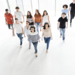 Group of enthusiastic business people walking